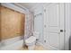 Cozy bathroom with tub and shower combination and white door at 401 Nichols Dr, Suwanee, GA 30024