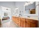 Bathroom with double vanity and doorway to main bedroom at 401 Nichols Dr, Suwanee, GA 30024