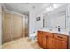 Bathroom with a large shower, single sink vanity, and tiled floor at 401 Nichols Dr, Suwanee, GA 30024