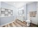 Bathroom featuring a double sink vanity, storage shelving, and modern finishes at 401 Nichols Dr, Suwanee, GA 30024