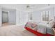 Large bedroom with a ceiling fan, two windows, and a walk-in closet at 401 Nichols Dr, Suwanee, GA 30024