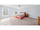 Spacious bedroom with a ceiling fan and lots of natural light from the windows at 401 Nichols Dr, Suwanee, GA 30024