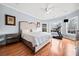 Bedroom features a treadmill, natural light, and ceiling fan at 401 Nichols Dr, Suwanee, GA 30024