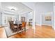 Well-lit dining room featuring hardwood floors and a large window that brings in natural light at 401 Nichols Dr, Suwanee, GA 30024