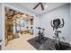 Finished basement exercise room featuring workout equipment and mirrored wall at 401 Nichols Dr, Suwanee, GA 30024