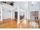 Grand foyer with soaring ceilings, hardwood floors, and a decorative starburst floor inlay at 401 Nichols Dr, Suwanee, GA 30024