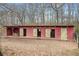 Rustic horse barn with individual stalls, providing shelter and space for horses at 401 Nichols Dr, Suwanee, GA 30024