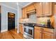 Kitchen with stainless steel appliances, granite countertops, and stylish backsplash at 401 Nichols Dr, Suwanee, GA 30024