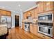 Updated kitchen boasting stainless steel appliances, granite countertops, and custom cabinetry at 401 Nichols Dr, Suwanee, GA 30024