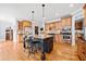 Elegant kitchen with a center island, stainless steel appliances, and hardwood flooring at 401 Nichols Dr, Suwanee, GA 30024