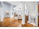 Bright, open living room with fireplace, hardwood floors, and white columns, creating a cozy space at 401 Nichols Dr, Suwanee, GA 30024