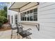 Inviting outdoor bar with awning and seating, perfect for enjoying drinks poolside at 401 Nichols Dr, Suwanee, GA 30024