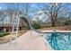 Enjoyable backyard pool slide feature offering hours of summertime fun for all ages at 401 Nichols Dr, Suwanee, GA 30024