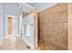 Walk-in shower with neutral tile and built-in shelves at 401 Nichols Dr, Suwanee, GA 30024
