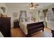 Spacious bedroom featuring a wood bed frame and large windows with curtains at 491 Princeton Ne Way, Atlanta, GA 30307