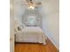 Cozy bedroom featuring a ceiling fan, hardwood floors, and a sunny window at 491 Princeton Ne Way, Atlanta, GA 30307