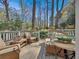 Inviting deck with comfortable seating, surrounded by serene greenery and mature trees at 491 Princeton Ne Way, Atlanta, GA 30307