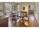 A traditionally styled dining room with hardwood floors and decorative wallpaper at 491 Princeton Ne Way, Atlanta, GA 30307