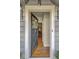 An open front door view of a home with hardwood floors and a decorative wreath at 491 Princeton Ne Way, Atlanta, GA 30307