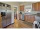 Bright kitchen featuring stainless steel appliances, granite countertops, and wood cabinets at 491 Princeton Ne Way, Atlanta, GA 30307