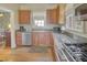 A well-equipped kitchen with granite countertops, wood cabinets, and stainless steel appliances at 491 Princeton Ne Way, Atlanta, GA 30307
