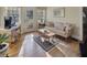 A sun-filled living room featuring hardwood floors, a comfortable seating area and sunlit windows at 491 Princeton Ne Way, Atlanta, GA 30307