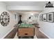 Finished basement offering a fireplace, foosball table, and comfortable sitting area at 5802 Oakleaf Dr, Stone Mountain, GA 30087