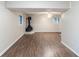 Finished basement with decorative fireplace, wood-look floors, and recessed lighting at 5802 Oakleaf Dr, Stone Mountain, GA 30087
