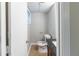 Compact bathroom featuring a toilet and vanity with a dark countertop at 5802 Oakleaf Dr, Stone Mountain, GA 30087
