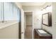 Bathroom features a window and dark vanity at 5802 Oakleaf Dr, Stone Mountain, GA 30087