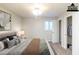 Virtually staged bedroom featuring carpeted floors and a window at 5802 Oakleaf Dr, Stone Mountain, GA 30087