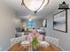 Dining room showcasing a lovely table, chairs, and decorative pendant light at 5802 Oakleaf Dr, Stone Mountain, GA 30087