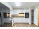 Bright kitchen with stainless steel appliances, granite countertops, and ample cabinet space at 5802 Oakleaf Dr, Stone Mountain, GA 30087