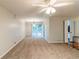 Spacious living room featuring new carpet and sliding glass doors at 5802 Oakleaf Dr, Stone Mountain, GA 30087