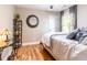 Cozy bedroom featuring hardwood floors and soft natural lighting, complemented by stylish decor at 955 Coleman Sw St, Atlanta, GA 30310