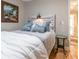 Comfortable bedroom with hardwood floors, soft lighting, and elegant decor at 955 Coleman Sw St, Atlanta, GA 30310
