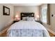 Bedroom with rustic wood headboard and matching bedside tables at 955 Coleman Sw St, Atlanta, GA 30310
