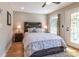 Bedroom with a rustic wood headboard and ample natural light at 955 Coleman Sw St, Atlanta, GA 30310