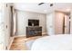 Bedroom with wood floors, large window, and a stylish dresser at 955 Coleman Sw St, Atlanta, GA 30310