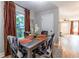 Dining area showcases stylish chairs and window, with a glimpse into the living room area at 955 Coleman Sw St, Atlanta, GA 30310