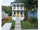 Charming two-story home with a welcoming yellow front door and dual front porches, offering curb appeal at 955 Coleman Sw St, Atlanta, GA 30310