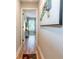 Hallway featuring hardwood floors and an inviting doorway to a bright living space at 955 Coleman Sw St, Atlanta, GA 30310