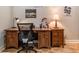 Warm and inviting home office featuring a wooden desk, wood floors, neutral colors, and natural light at 955 Coleman Sw St, Atlanta, GA 30310