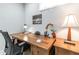 Home office featuring a wooden desk, wood floors, neutral colors, natural light, and artwork at 955 Coleman Sw St, Atlanta, GA 30310