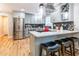 Modern kitchen with stainless steel appliances, a breakfast bar, and stylish backsplash at 955 Coleman Sw St, Atlanta, GA 30310