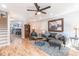 Open-concept living room with hardwood floors, recessed lighting, and a stylish ceiling fan, perfect for entertaining at 955 Coleman Sw St, Atlanta, GA 30310