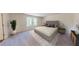 Serene bedroom with plush bed, contemporary decor, bedside tables, and large windows for natural light at 175 Silverton Dr, Dacula, GA 30019
