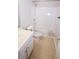 Bright bathroom featuring a white vanity, tile flooring, and a shower-tub combination at 2263 Leicester Se Way, Atlanta, GA 30316