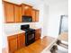 Functional kitchen space with wood cabinets, essential appliances, and ample counter space at 2263 Leicester Se Way, Atlanta, GA 30316