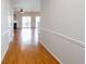 Bright living room showcasing hardwood floors, a cozy fireplace, and sliding glass doors to the outdoor at 2263 Leicester Se Way, Atlanta, GA 30316